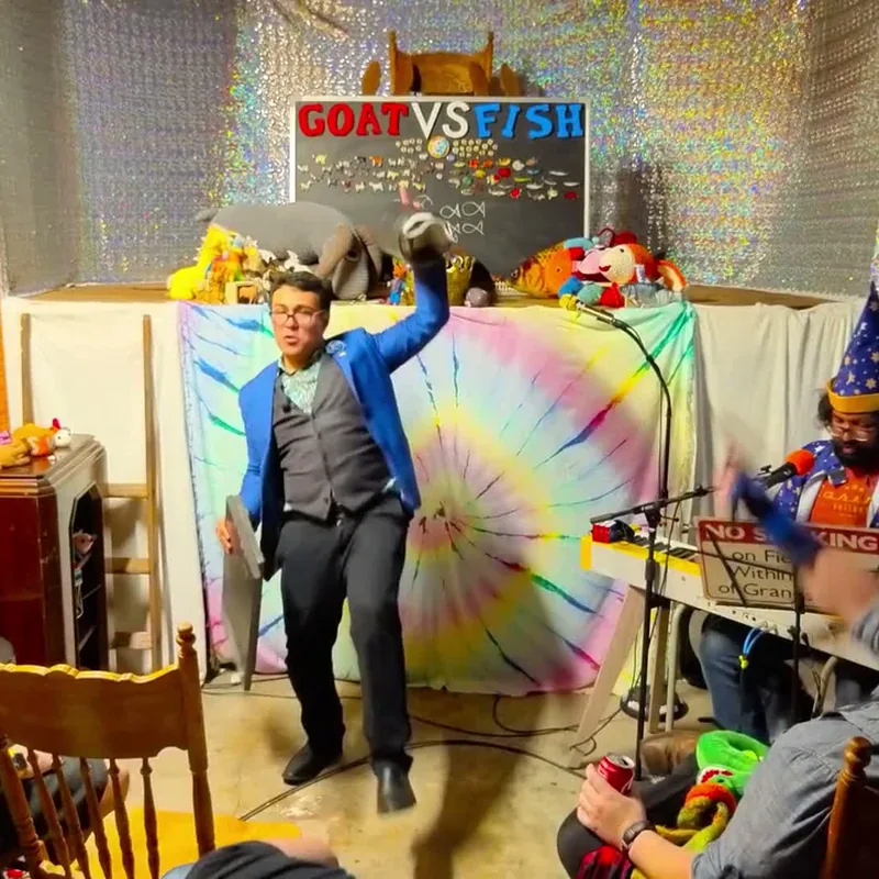 A Guest Sermonizer dancing in front of the tie-dye altar